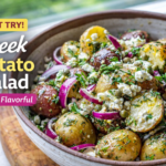 Fresh Greek potato salad with feta and herbs in bowl